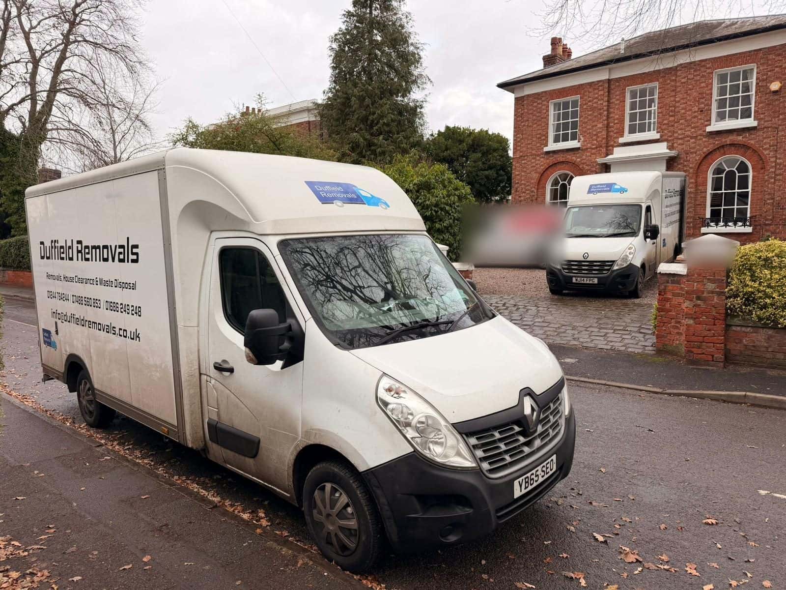Duffield Luton van outside a Georgian red-brick house on moving day