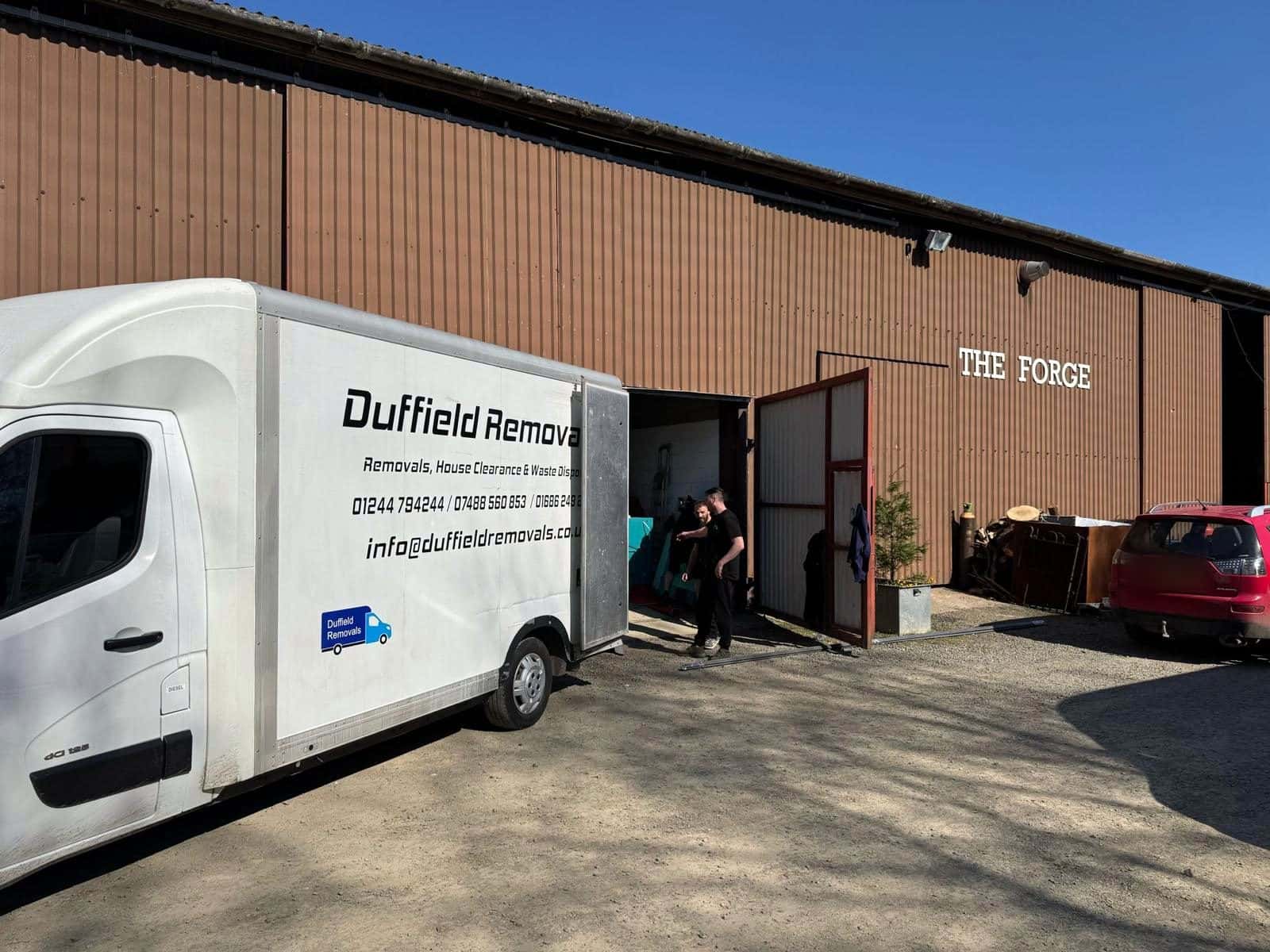 Duffield crew moving goods into THE FORGE crated storage warehouse at Rhayader