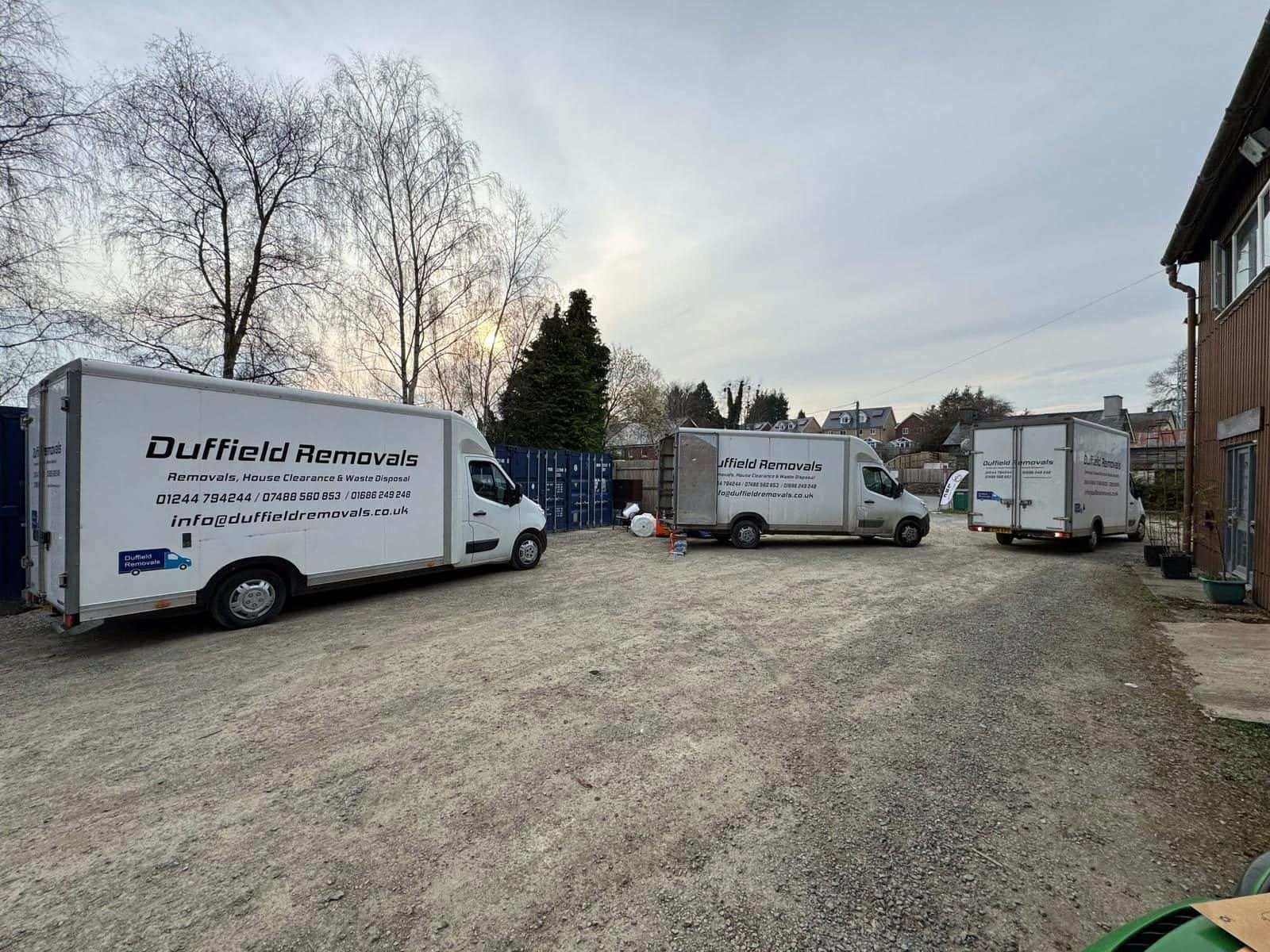 Three Duffield vans in the Rhayader storage yard at dusk