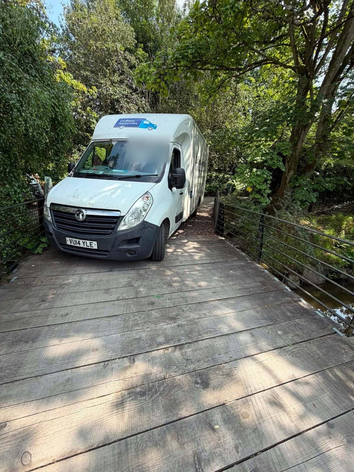 Duffield Luton van on a narrow timber bridge over a stream