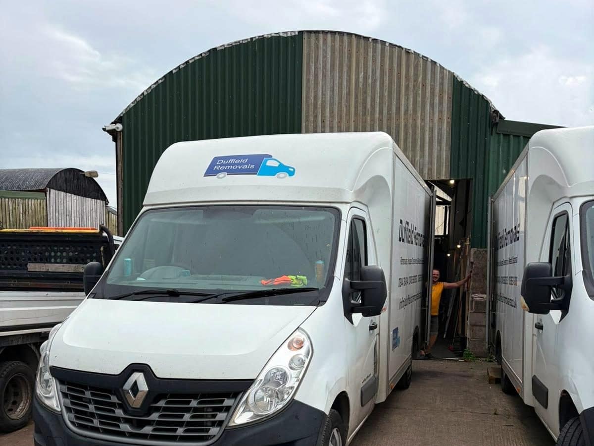 Duffield Removals van in front of the green arched barn at the Chester workshop