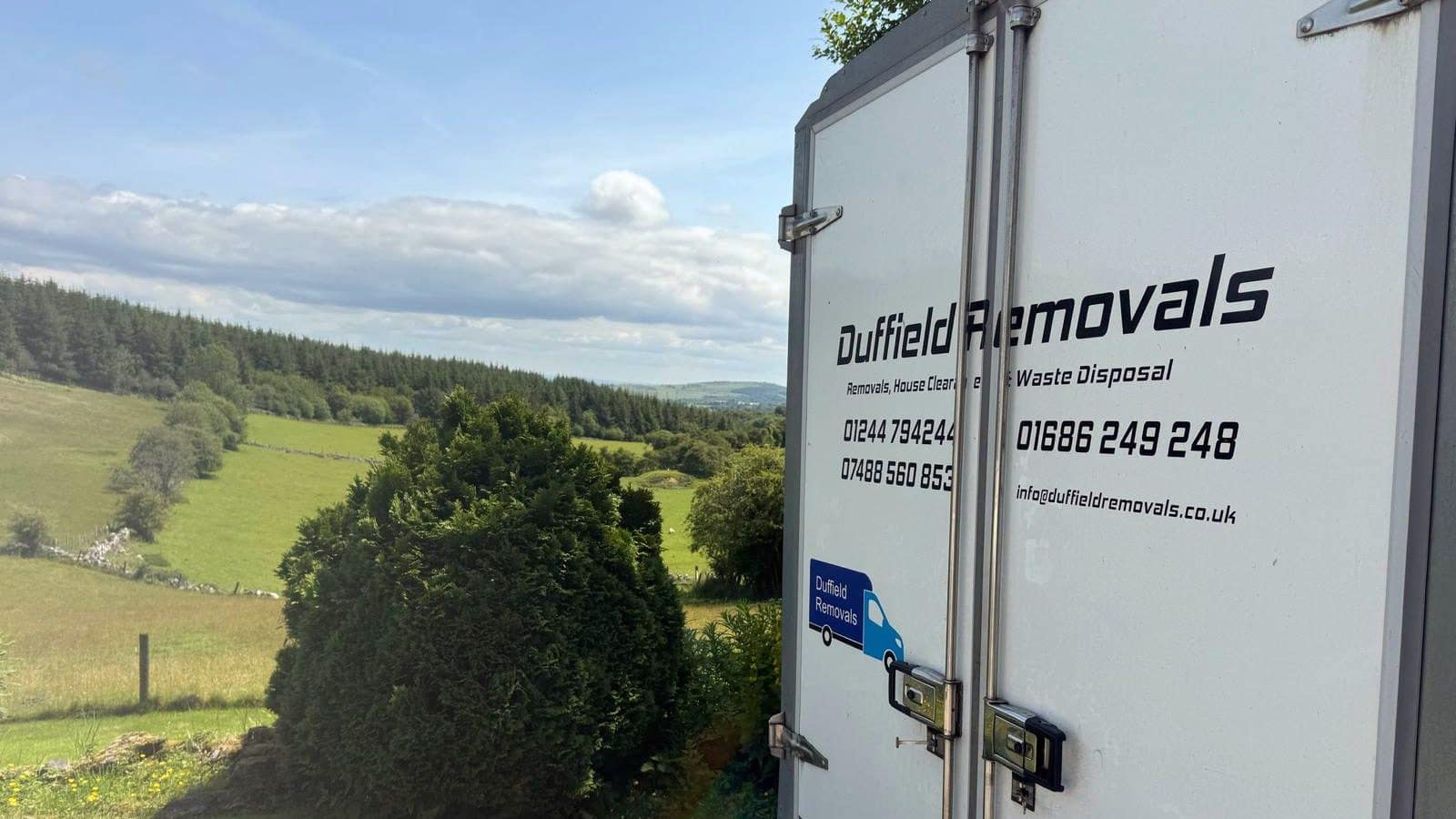 Rear doors of a Duffield van showing house clearance, the Chester number and a green valley