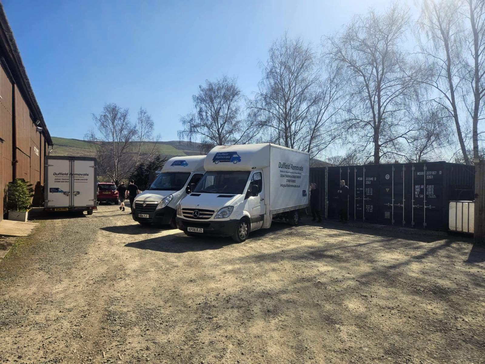Duffield Removals Mid Wales vans in the Rhayader yard, with Removals, House Clearance and Waste Disposal on the side