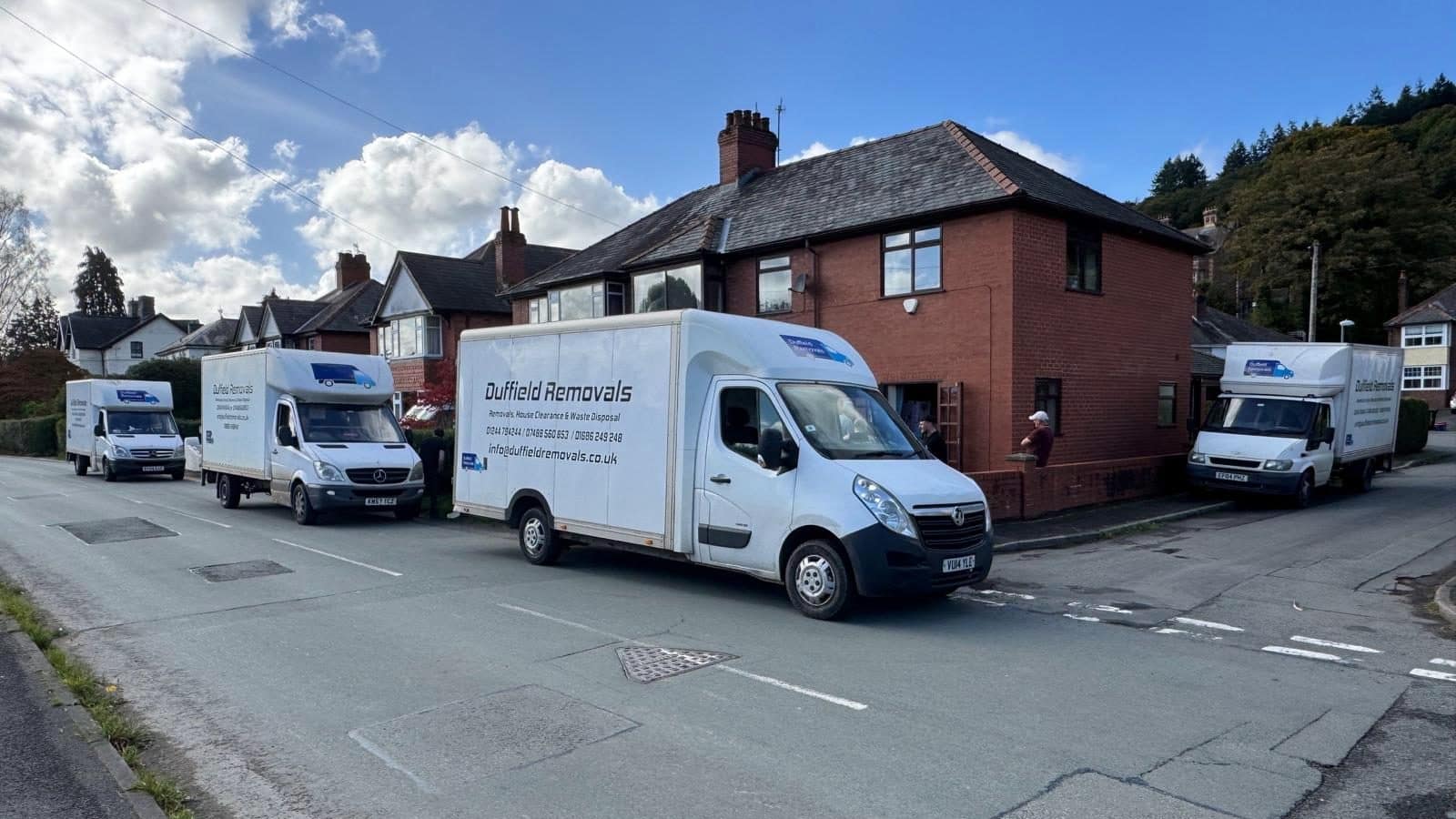 Four Duffield Removals vans outside a family home for one house move