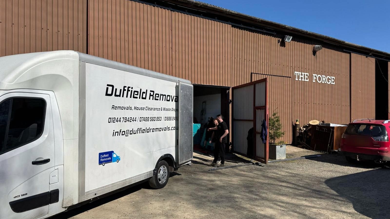 Duffield crew moving goods into THE FORGE, the crated indoor storage warehouse at Rhayader